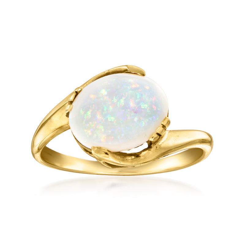 Vintage opal cabochon ring in 10kt yellow gold, oval stone in gold prongs