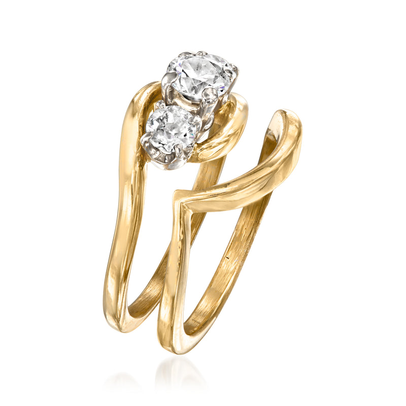 Yellow gold three-stone diamond engagement ring with matching curved wedding band, side view
