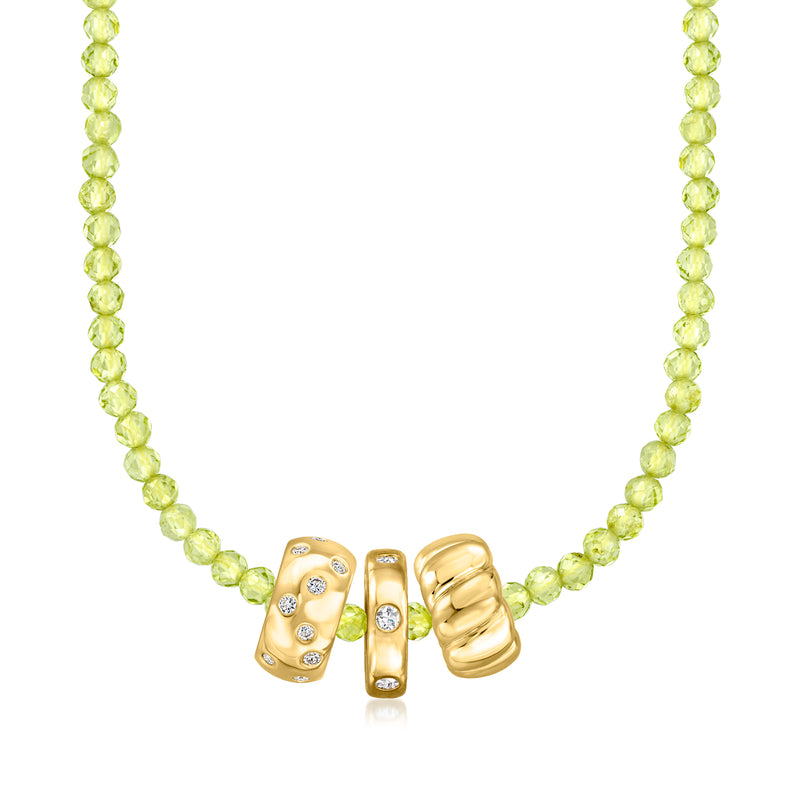Peridot bead necklace with gold barrel charms and small gemstone details