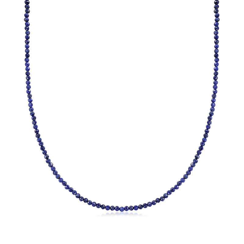 Lapis bead necklace with small round deep blue stones on a gold-tone chain