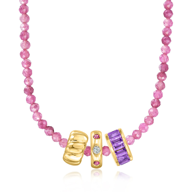 Pink tourmaline bead necklace with gold-tone centerpiece and purple accents