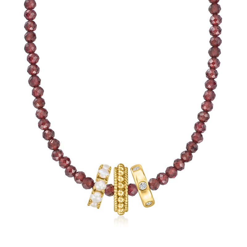Garnet bead necklace with gold-tone charm and small clear accents at center