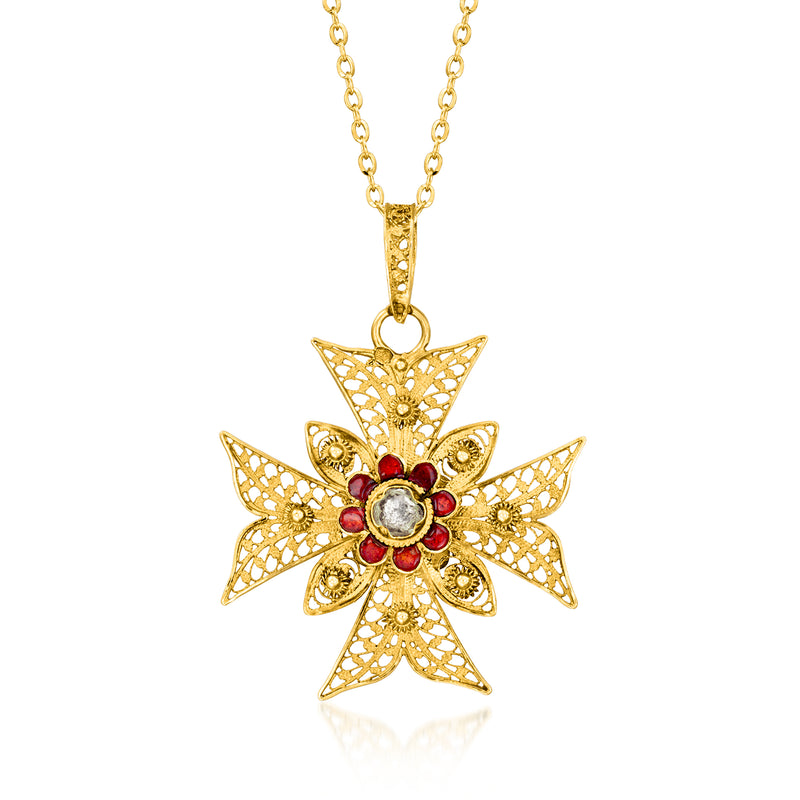 Gold cross pendant necklace with red enamel accents and a clear center stone