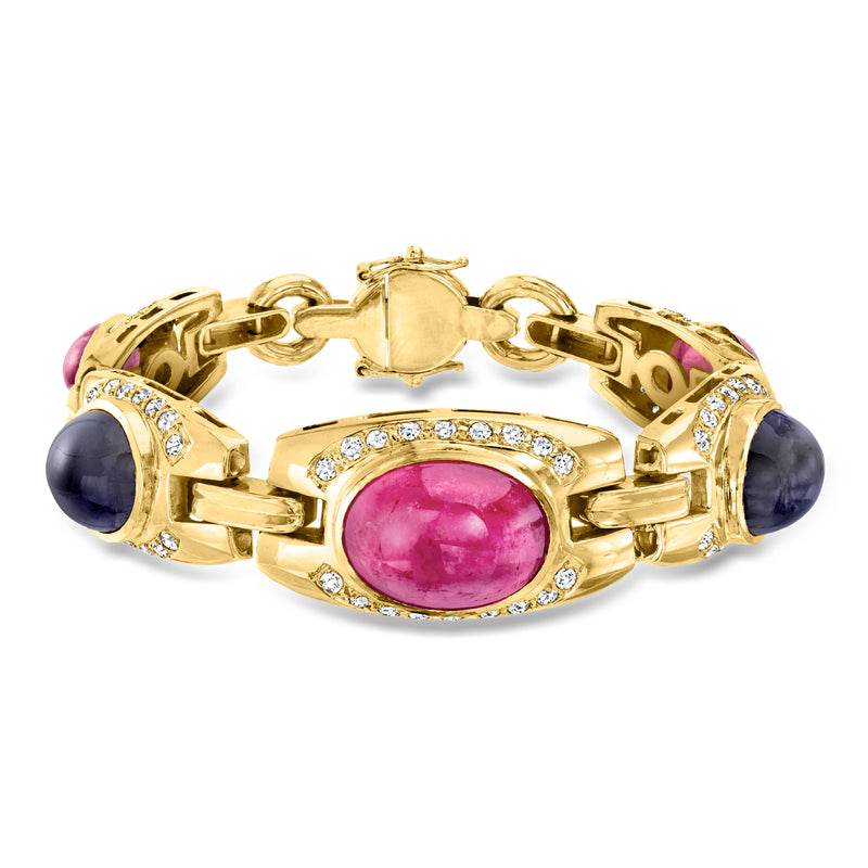 18k yellow gold gemstone bracelet with oval pink center and dark oval side stones