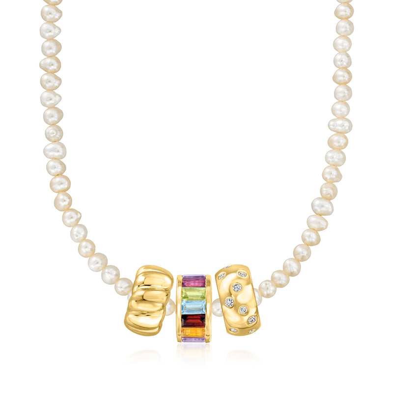 Pearl strand necklace featuring a gold multi-gemstone baguette bead charm