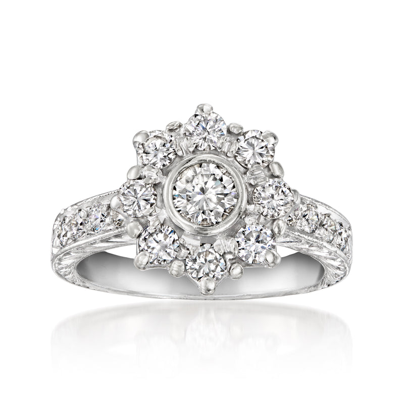 Platinum diamond flower ring with round center stone and halo of small diamonds