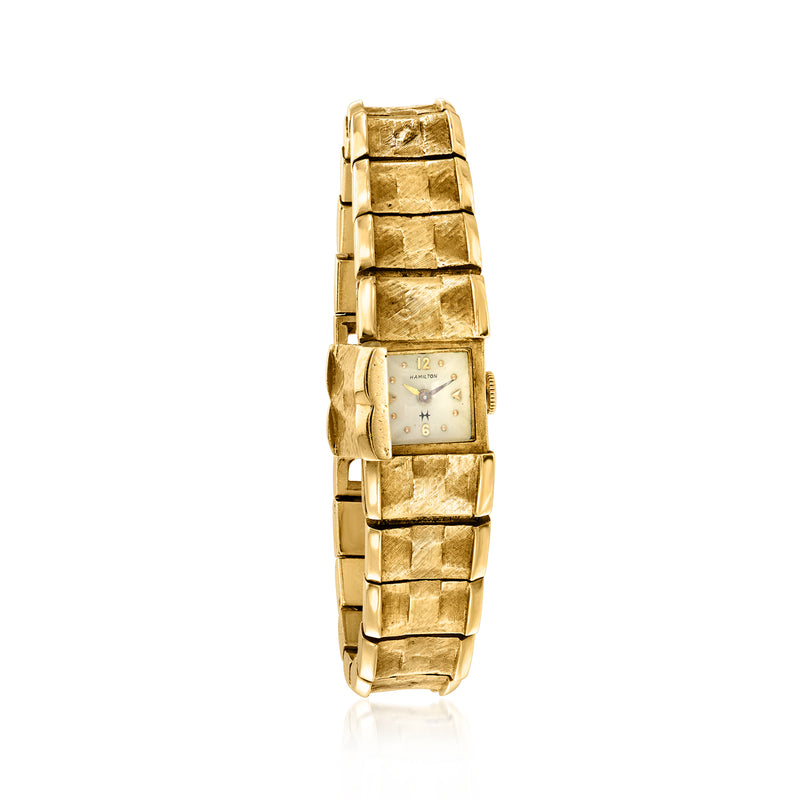 Vintage yellow gold watch with rectangular dial, markers, and crown