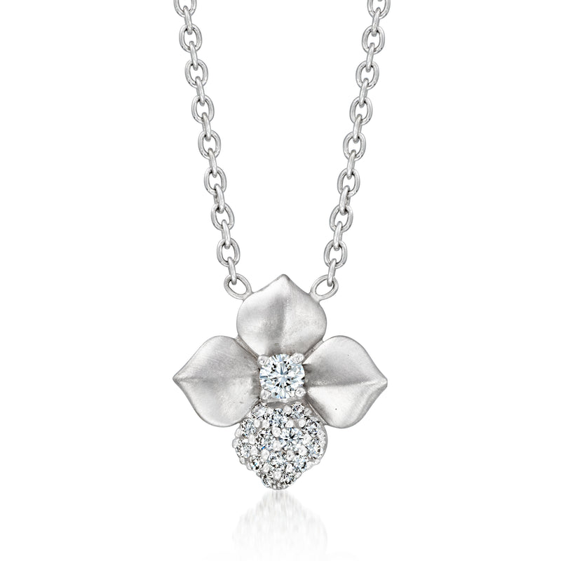 18k white gold diamond flower necklace with round cluster center and petal details