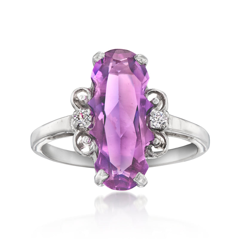 10kt white gold ring with large purple synthetic sapphire center and small clear accents