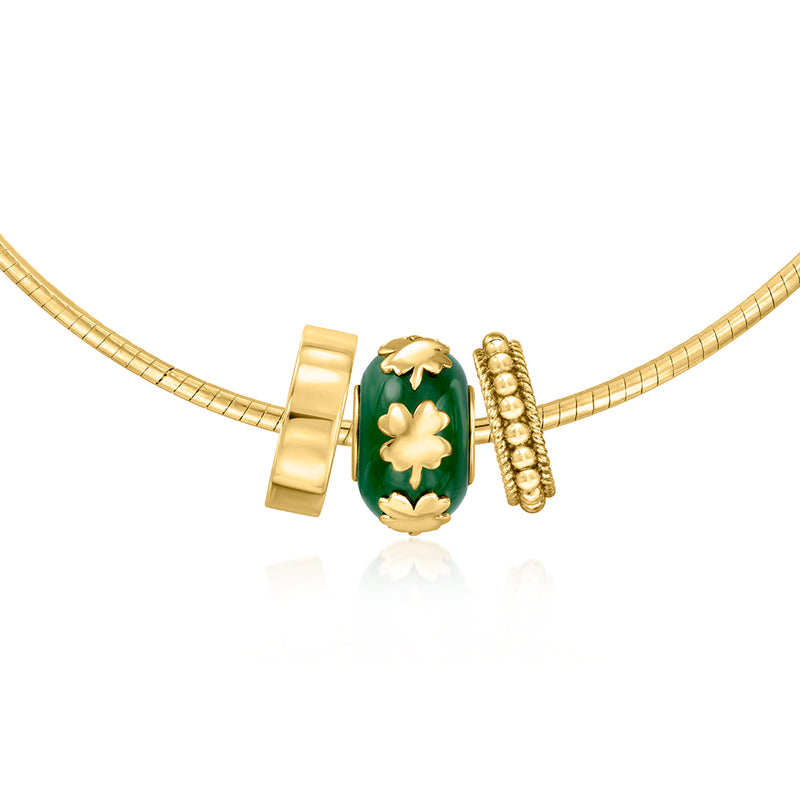 Green jade bead clover charm with gold spacers on a gold bracelet