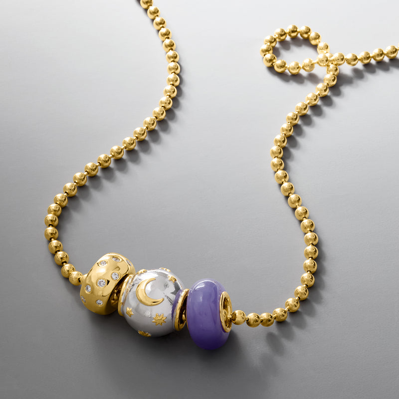 Gold bead necklace with purple oval jade bead and patterned spacer charms