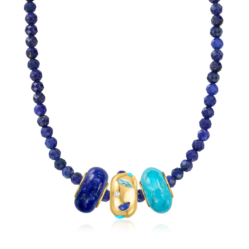 Blue beaded necklace with central gold charm and three colored gemstone stones