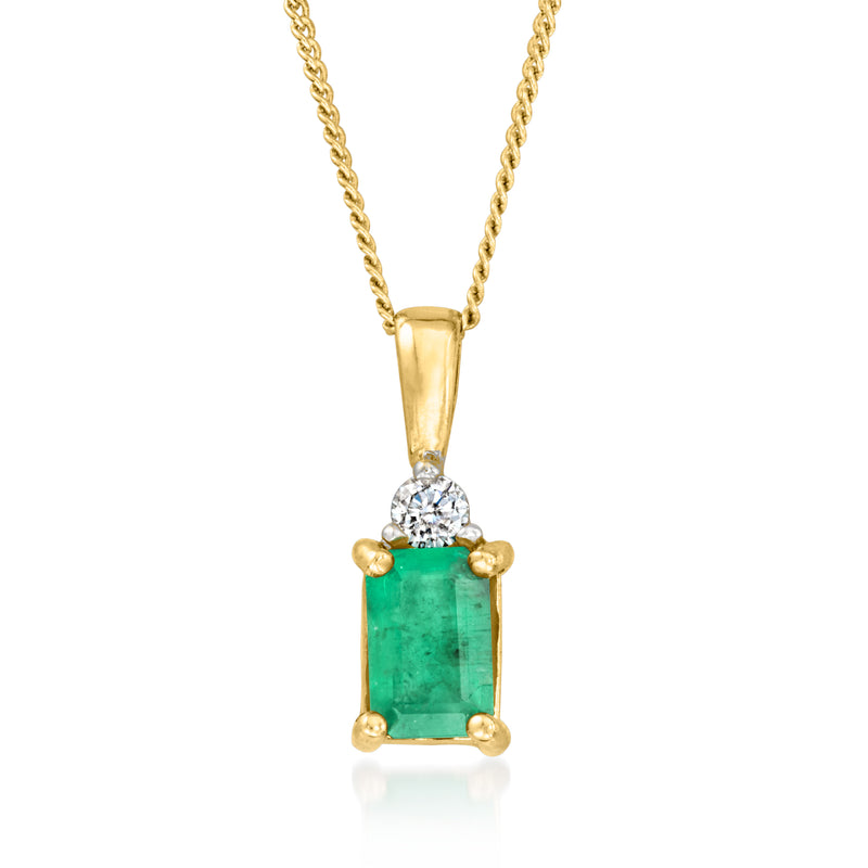 Vintage gold pendant necklace with emerald green rectangular stone and round diamond cluster
