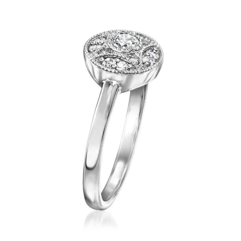 Sterling silver vintage halo diamond ring with round center stone and openwork shank