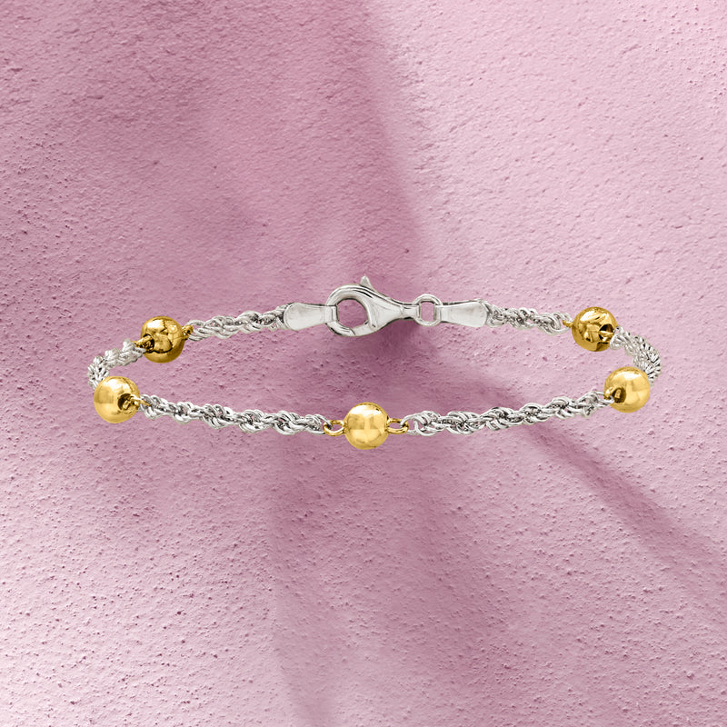 Silver rope-chain bracelet with gold round end beads and center gold station