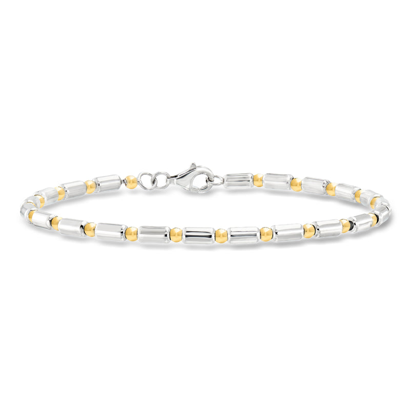 Station bracelet with dot-and-dash links in silver and gold-tone