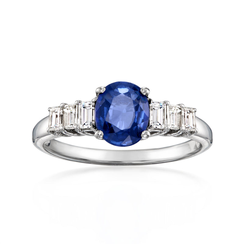 White gold ring with oval blue sapphire center and baguette diamond sides