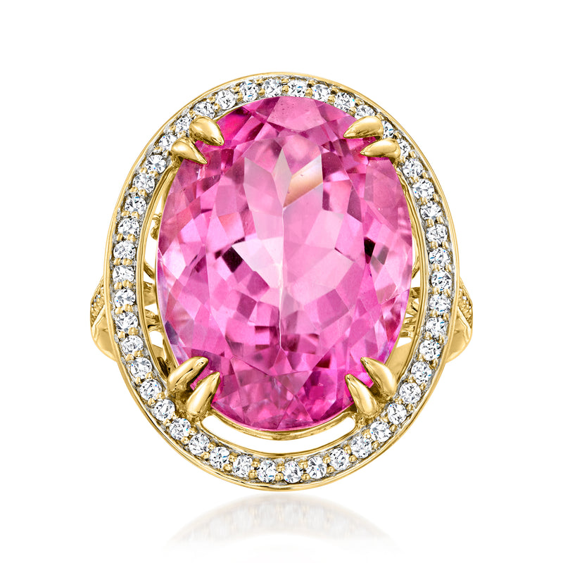 Oval pink gemstone halo ring in 14kt yellow gold with round diamond accents