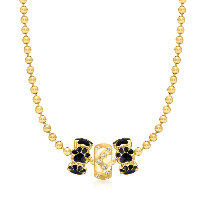 Gold bead necklace featuring black enamel paw print charms on a bead chain.