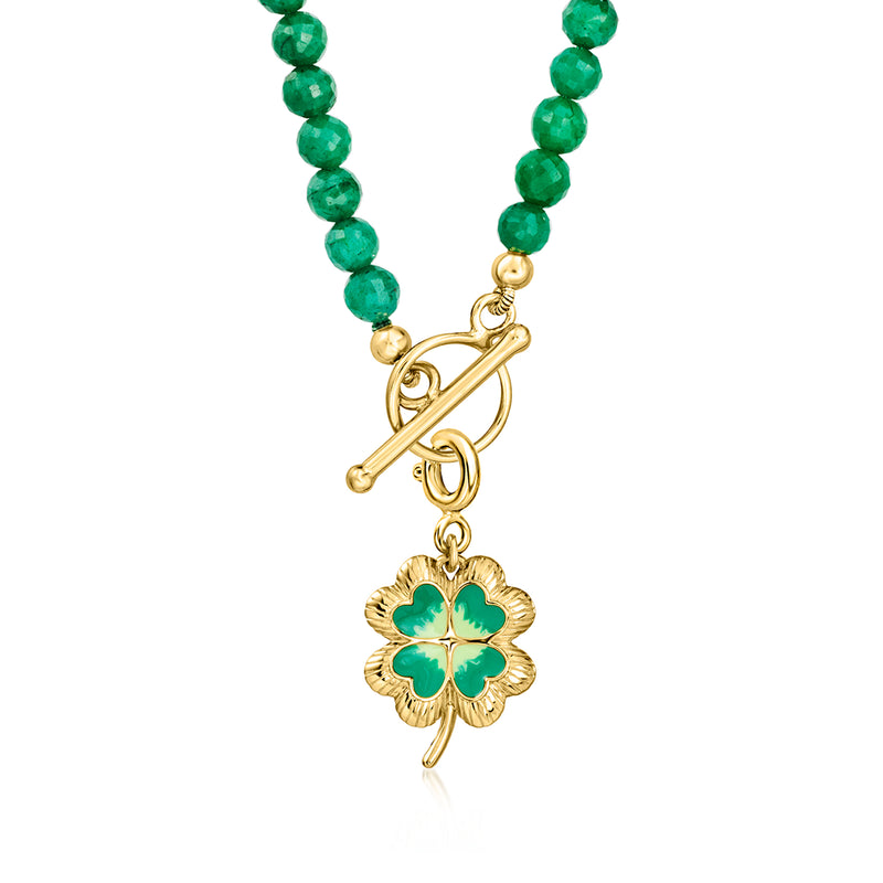 Green beaded necklace with gold-tone clover pendant on a hanging bail loop