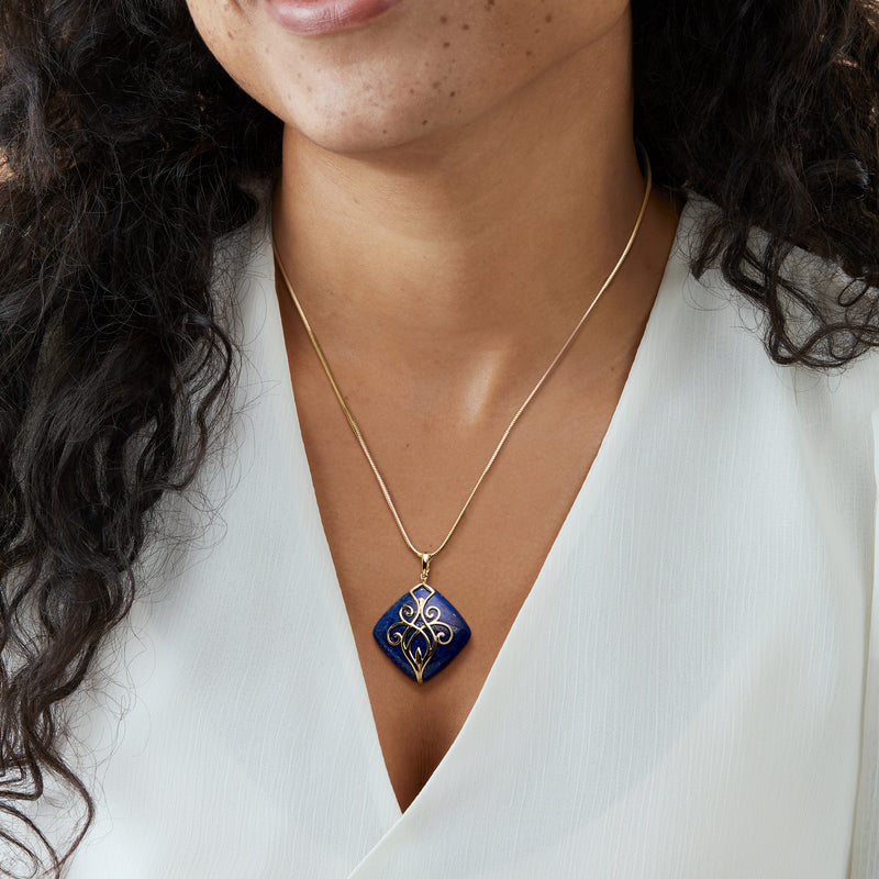 Lapis blue square scroll pendant necklace in 14kt yellow gold, worn on neck