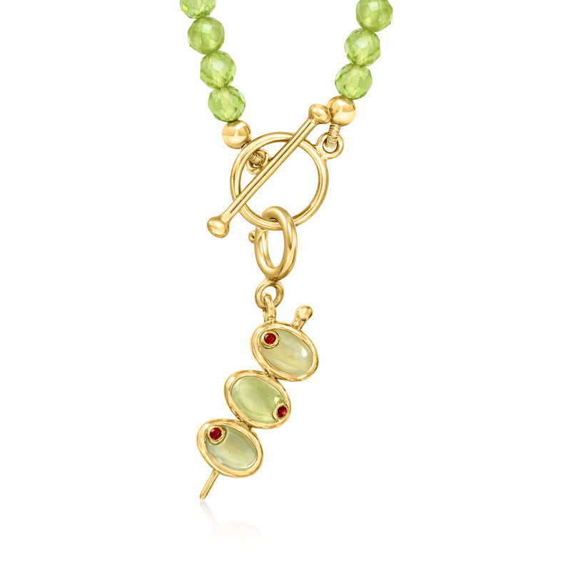 Gold olive charm with faceted green beads and three oval green stones with red tips