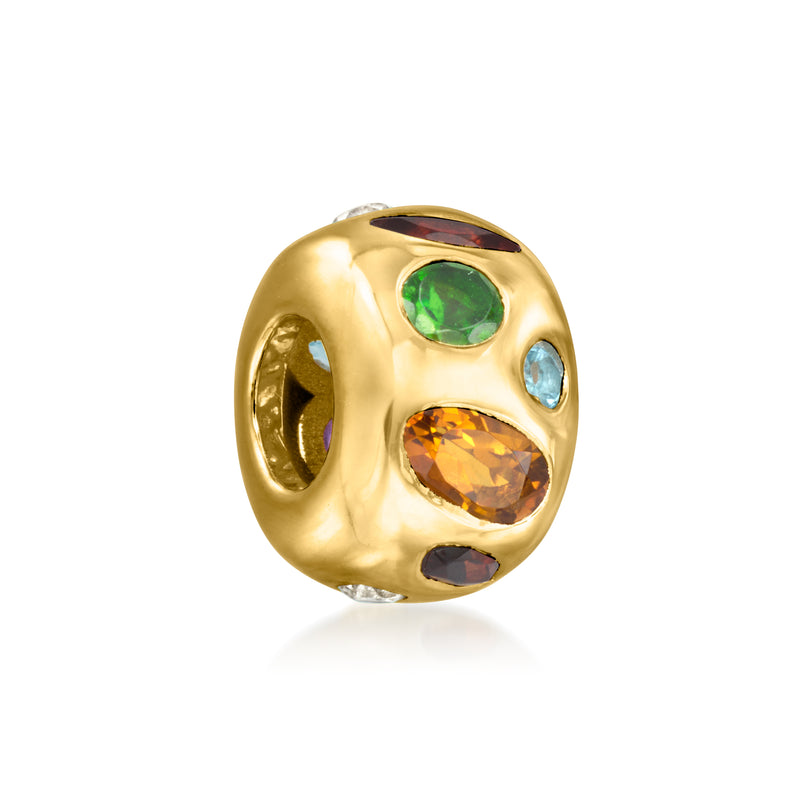 Gold bead charm with a green center stone and blue and orange stones on the sides