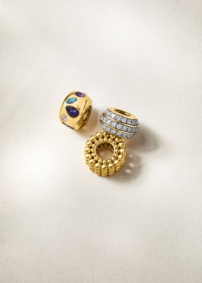 Gold bead charms: multi-gemstone bead, blue stone disc charm, and textured ring charm