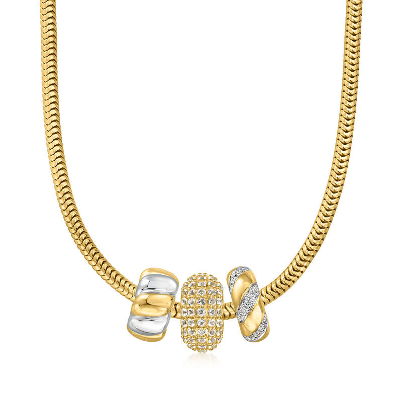 Gold chain necklace with oval beaded topaz charm and two polished metal spacers