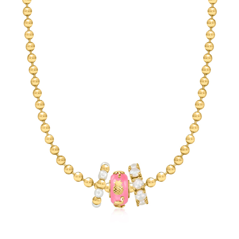 Gold beaded necklace featuring pink tropical bead charm with pineapple and palm ornaments