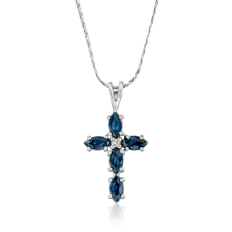14k white gold cross pendant necklace with blue sapphire stones and a small diamond