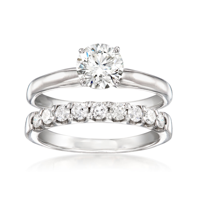 Two white gold diamond rings: round center stone with matching pave band