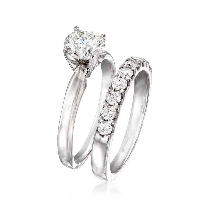 White gold diamond engagement set with large round center and side pave accents