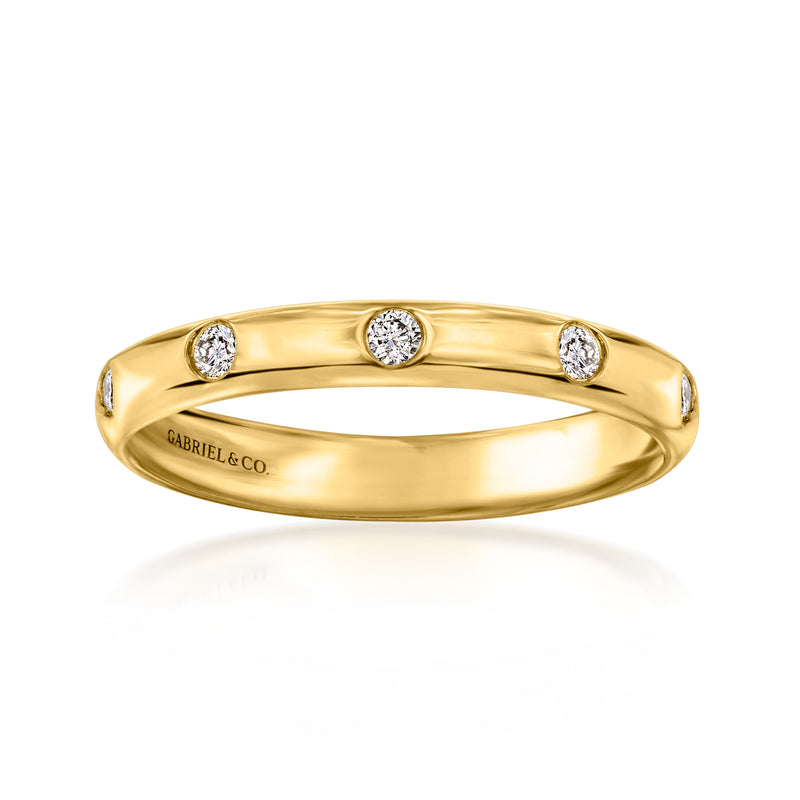 14kt yellow gold diamond station ring with three round bezel-set stones