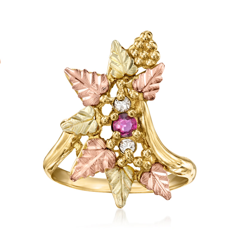 Two-tone gold leaf ring with pink ruby center and clear diamond accents