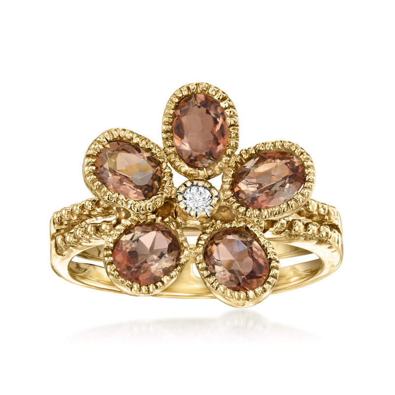 10kt yellow gold flower ring with pink oval stones and a round diamond center