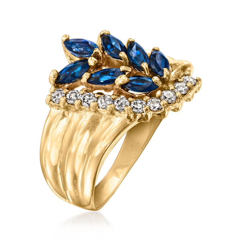 14kt yellow gold ring with clustered blue oval sapphires and round diamond accents