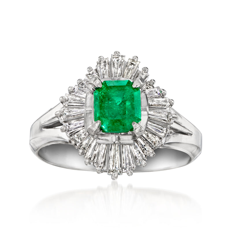 Platinum ballerina ring with green emerald-cut center and diamond halo