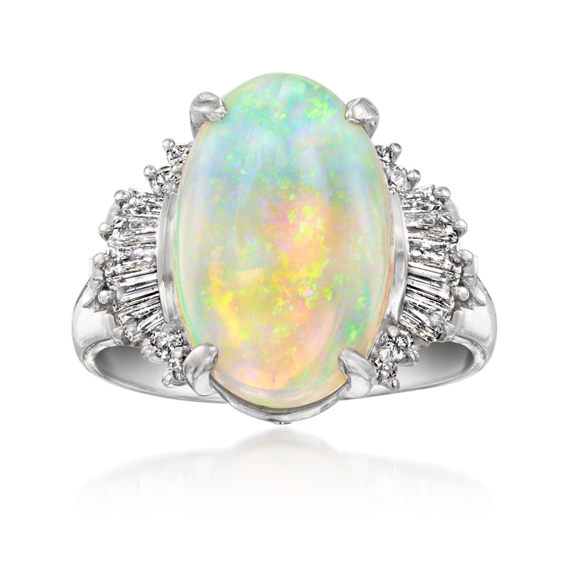 Vintage opal ring in platinum with oval opal center and diamond side clusters