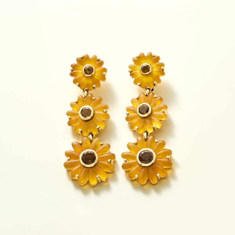 Gold sunflower drop earrings with three stacked blooms and dark center stones