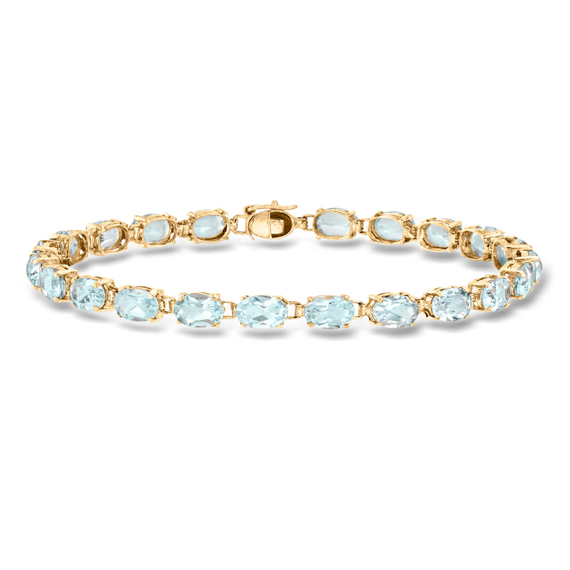 Sky blue topaz link bracelet in 14kt yellow gold with oval stones, hinged style