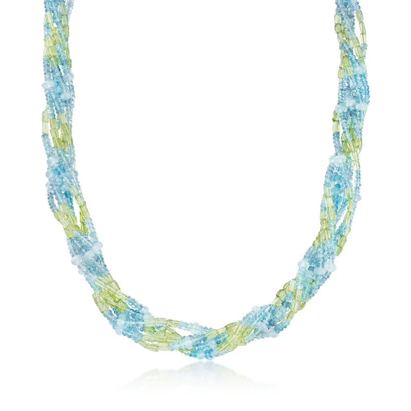 Bead torsade necklace with light blue and green stones on a white gold chain