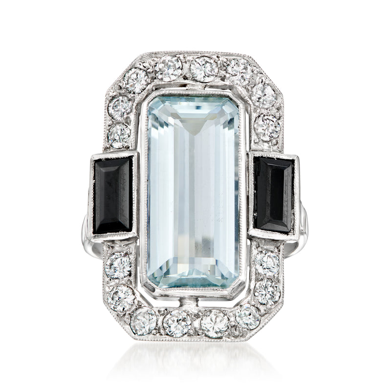 Platinum ring with rectangular light blue aquamarine, black onyx sides, diamond halo