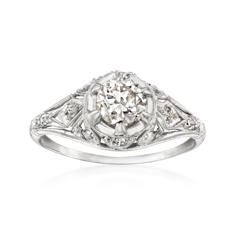 Platinum vintage diamond filigree ring with round center stone, openwork shoulders