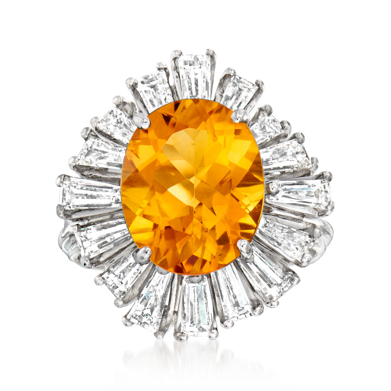 Oval orange citrine ring with baguette diamond halo and white gold band
