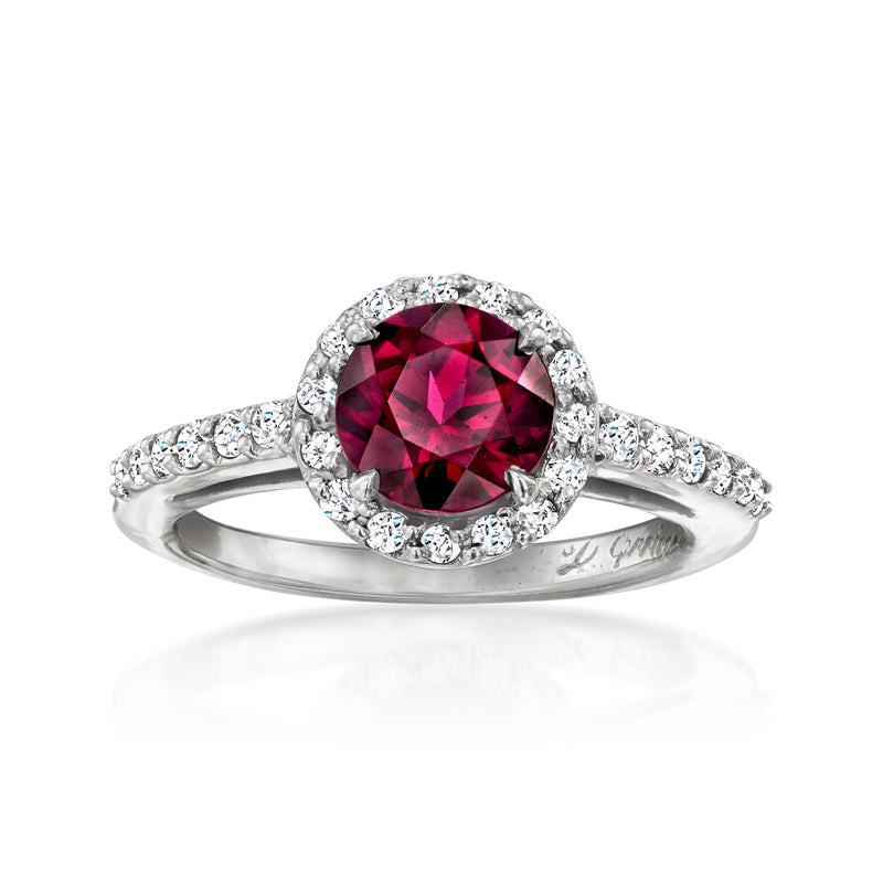 Platinum ring with round rhodolite garnet, diamond halo, and pavé diamond band