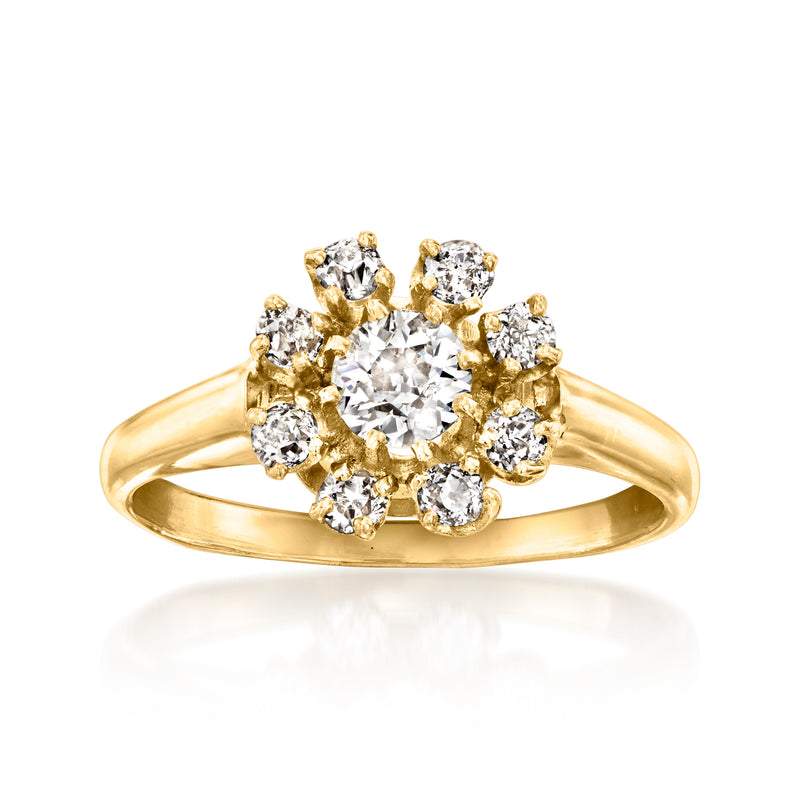 14kt yellow gold vintage diamond flower ring with round center stone and side diamonds
