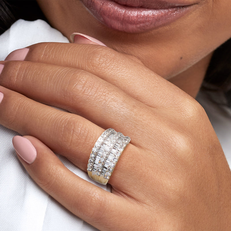 Diamond multi-row ring in 14kt yellow gold shown on finger, close-up