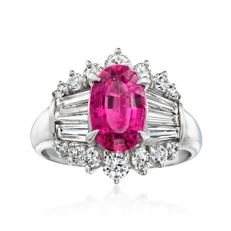 Platinum ring with oval pink tourmaline center, diamond halo and side baguettes