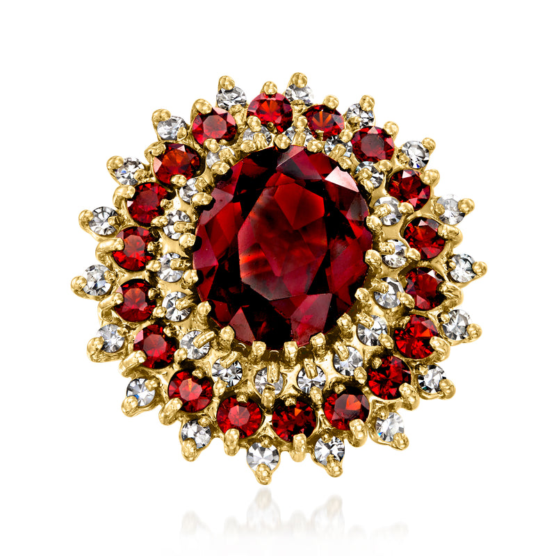 Vintage 18kt yellow gold ring with round red garnet center and diamond halo